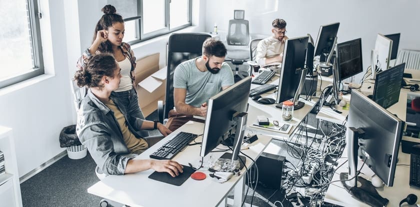Group of programmers and software developers working on a new project at the office.